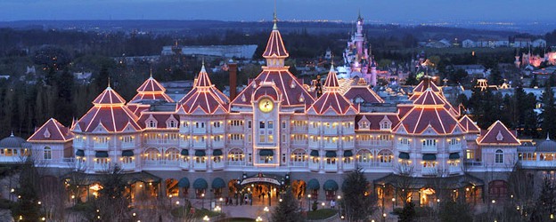 Guests pass under the Disneyland Hotel in Paris to enter Disneyland Park.
