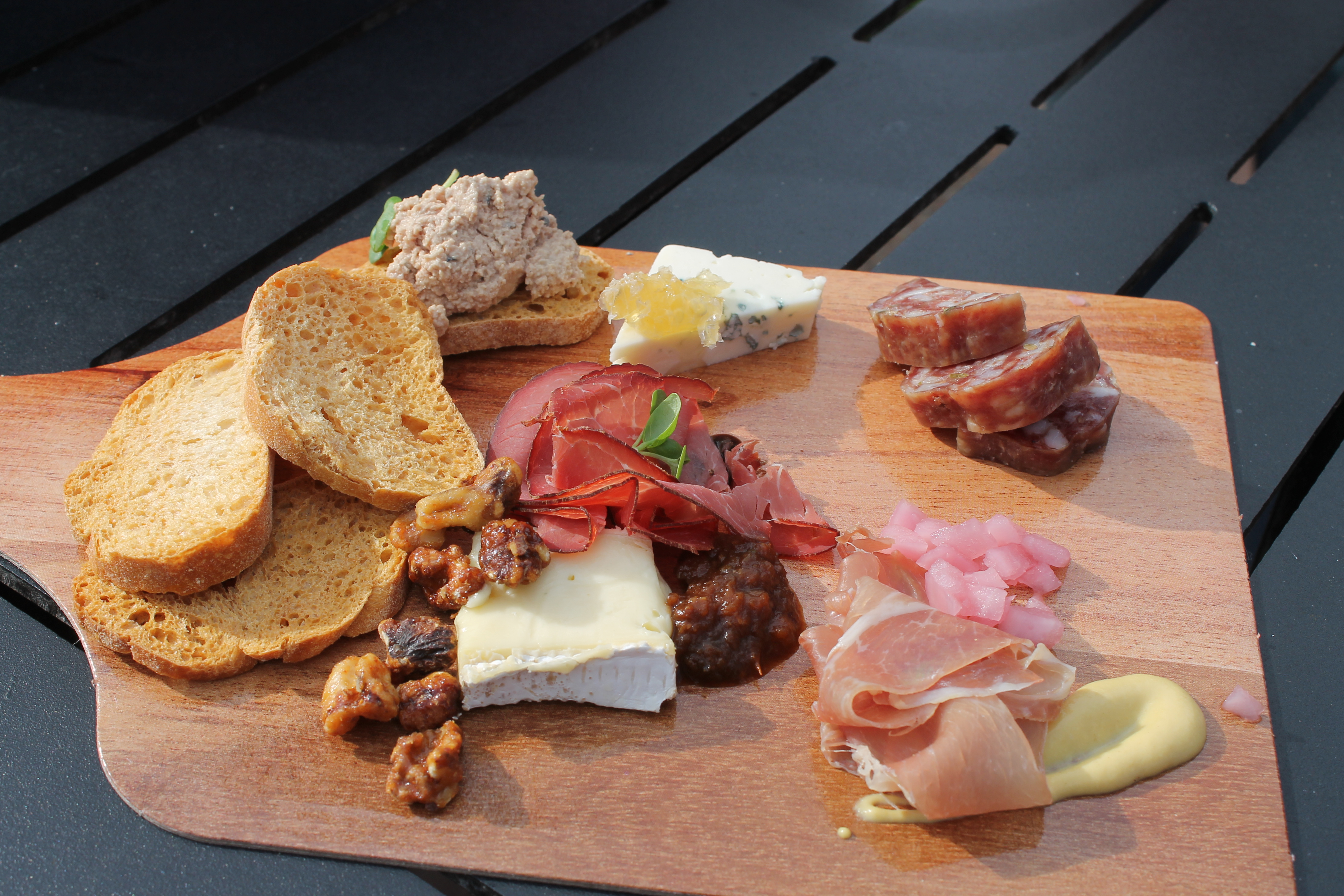 Charcuterie Palette with Artisan Cured Meats, Nueske’s Smoked Beef and Cheese $14.00