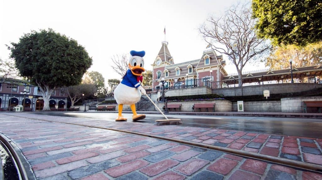 Donald Duck cleaning the new bricks in Main Street, U.S.A. in the Disneyland Resort