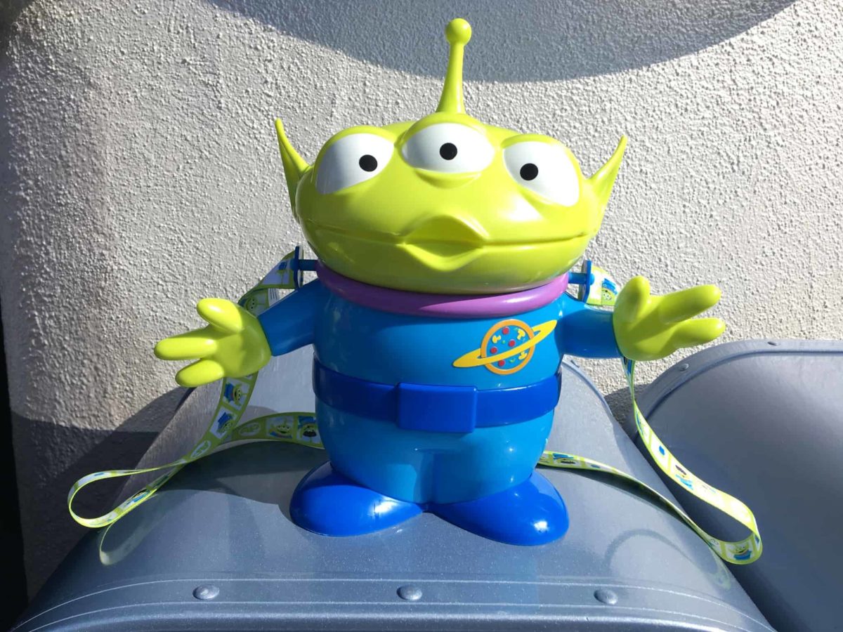 The front of the Annual Passholder-exclusive refillable popcorn bucket of Toy Story's Little Green Alien, released in celebration of Disneyland's PIXAR Fest