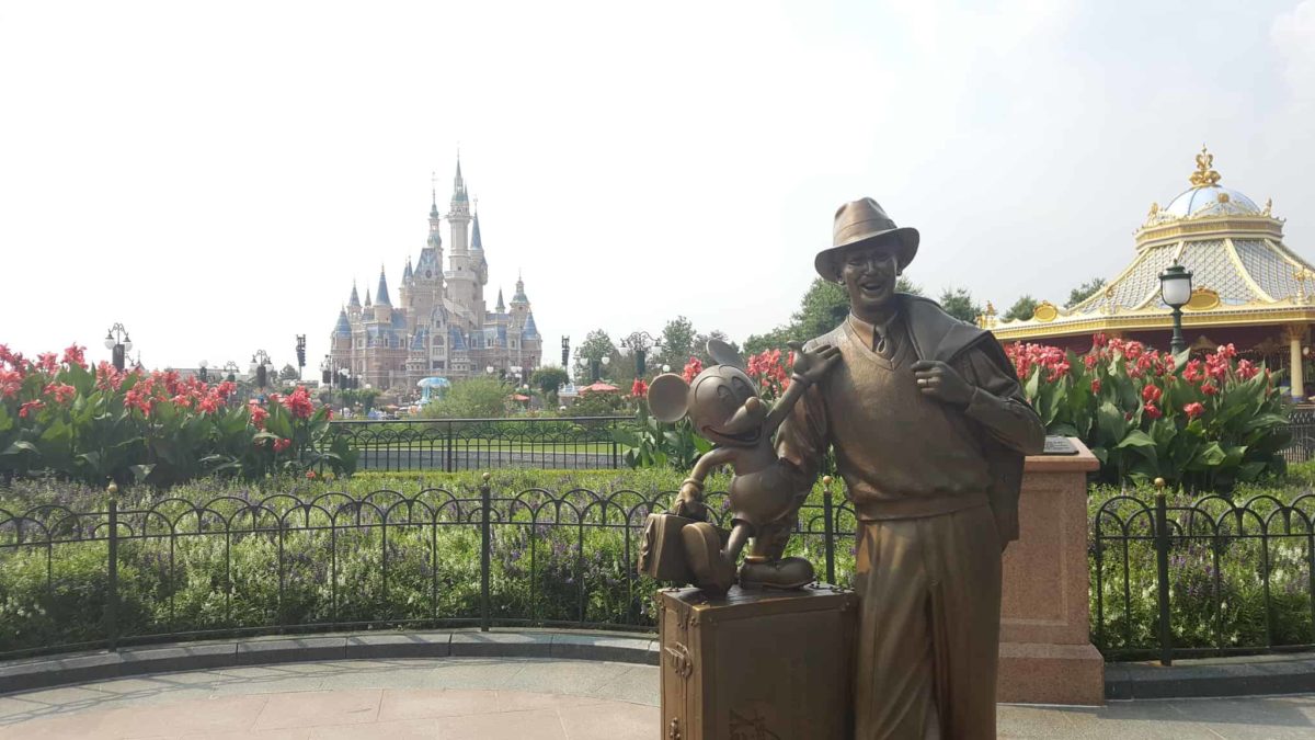 Partner statue Mickey and Walt Disney in Shanghai Disneyland with the Enchanted Storybook Castle