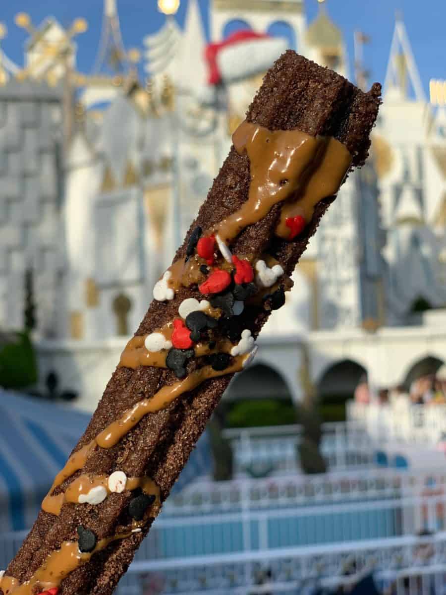 mickey mouse celebration churro disneyland resort small world promenade churro cart