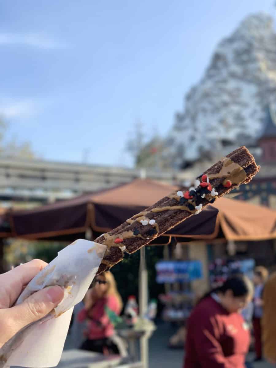 mickey mouse celebration churro disneyland resort small world promenade churro cart