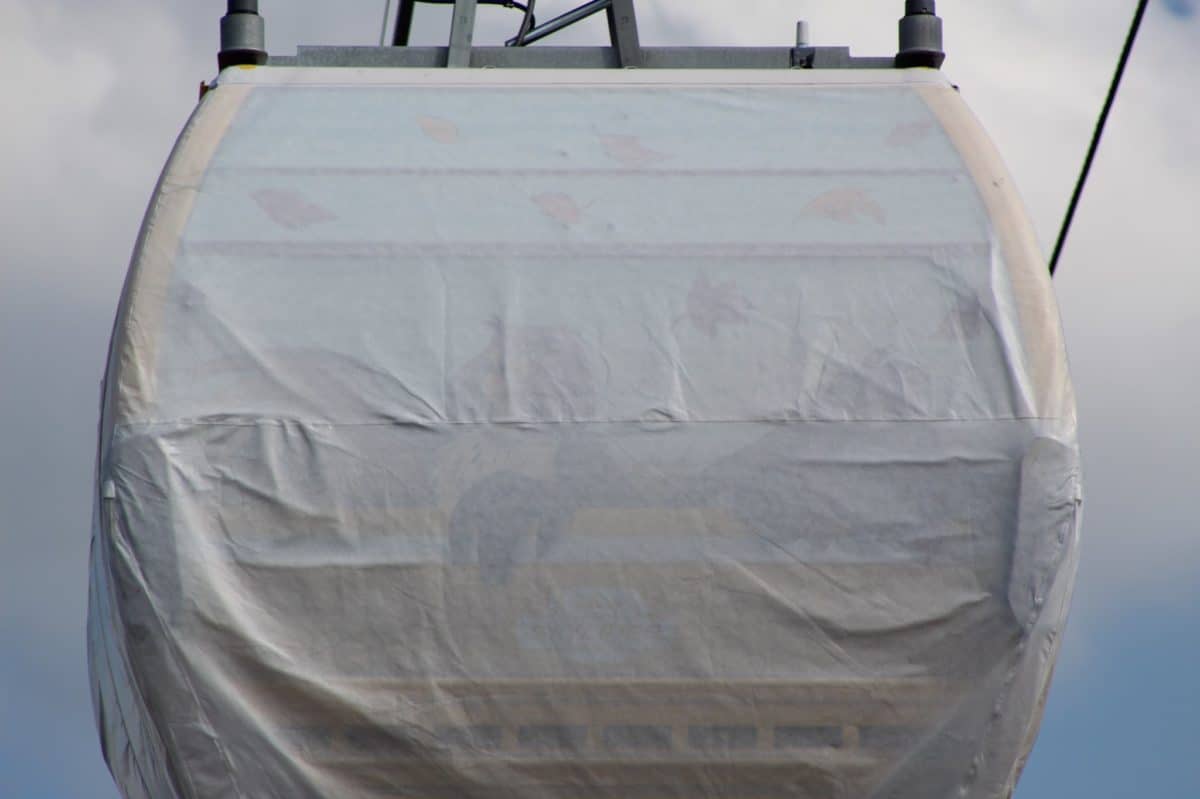 disney skyliner gondolas designs beneath tarps full capacity