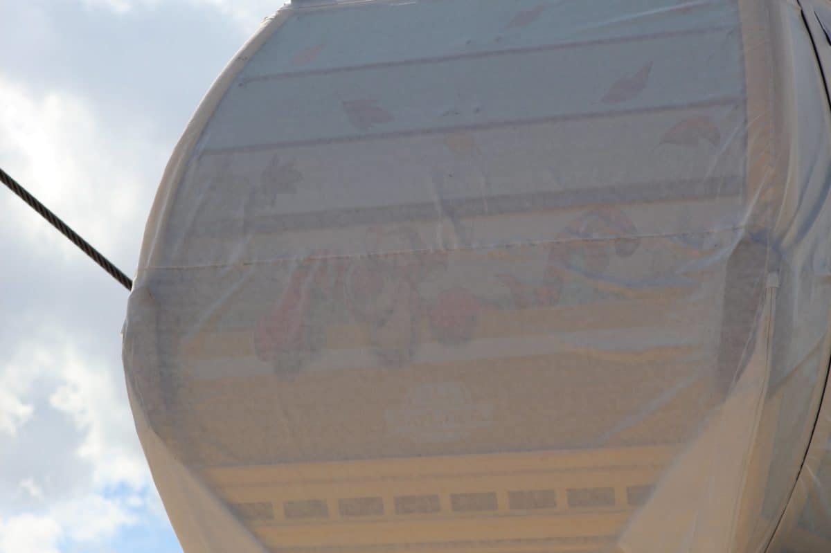 disney skyliner gondolas designs beneath tarps full capacity