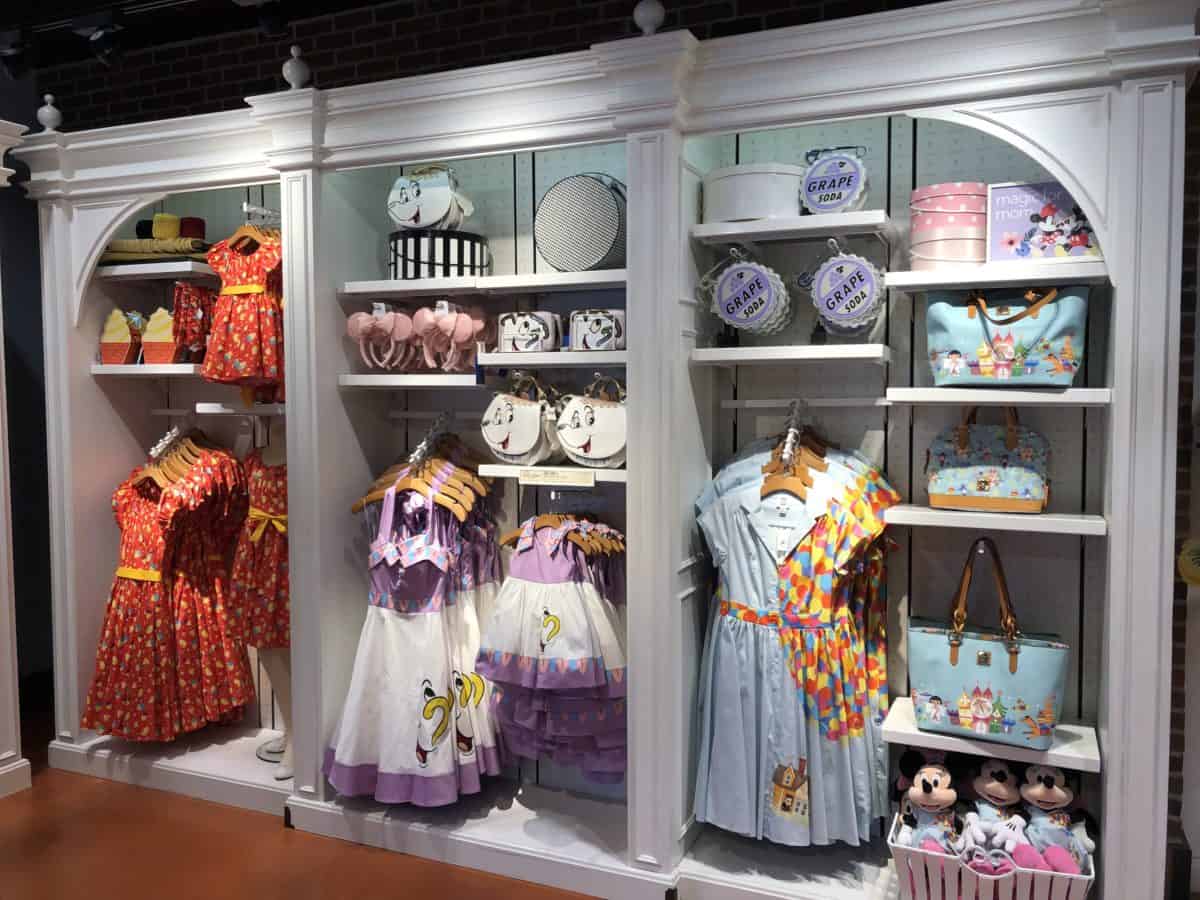 Up, Beauty and the Beast, and Dole Whip Dresses and Accessories on display at the Co-Op at Disney Springs