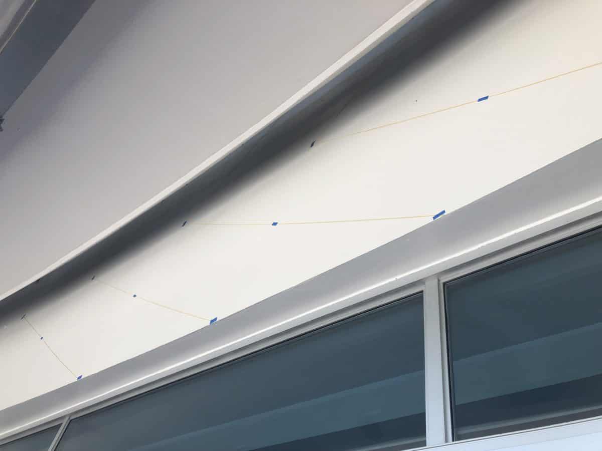 Lines are marked for future painting over the doorway of Merchant of Venus