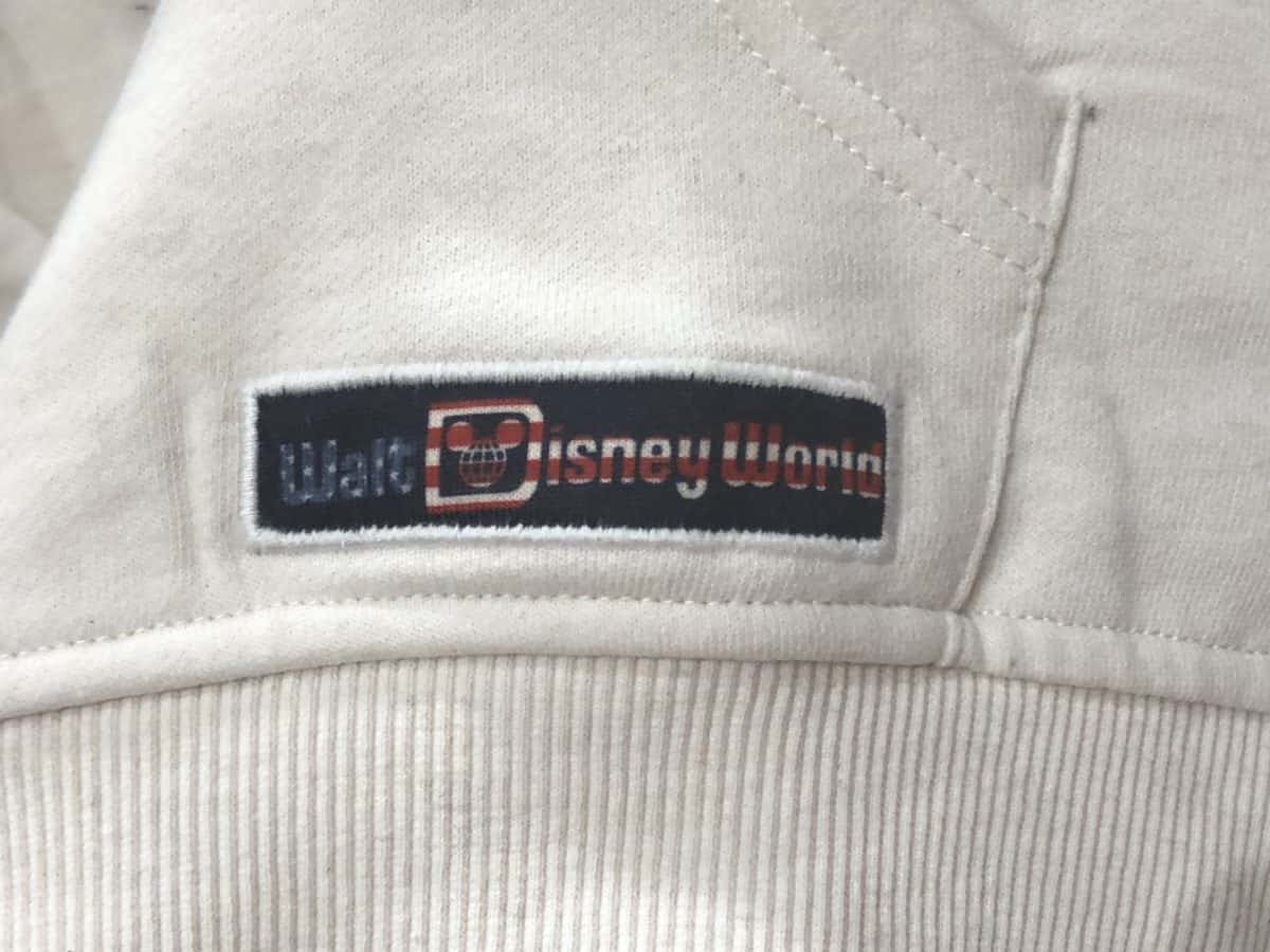 Walt Disney World patch on the pocket of the Americana half-zip sweater