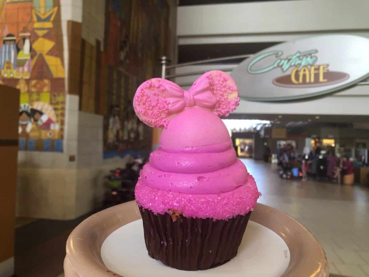 Imagination Pink Cupcake Contempo Cafe. A bright pink frosted cupcake topped with mickey ears