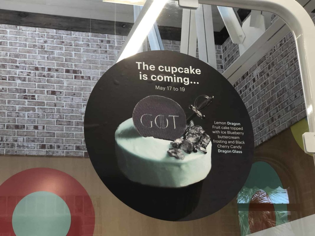 Lemon dragon fruit cake with blueberry buttercream and black cherry candy with a Game of Thrones piece and plastic sword