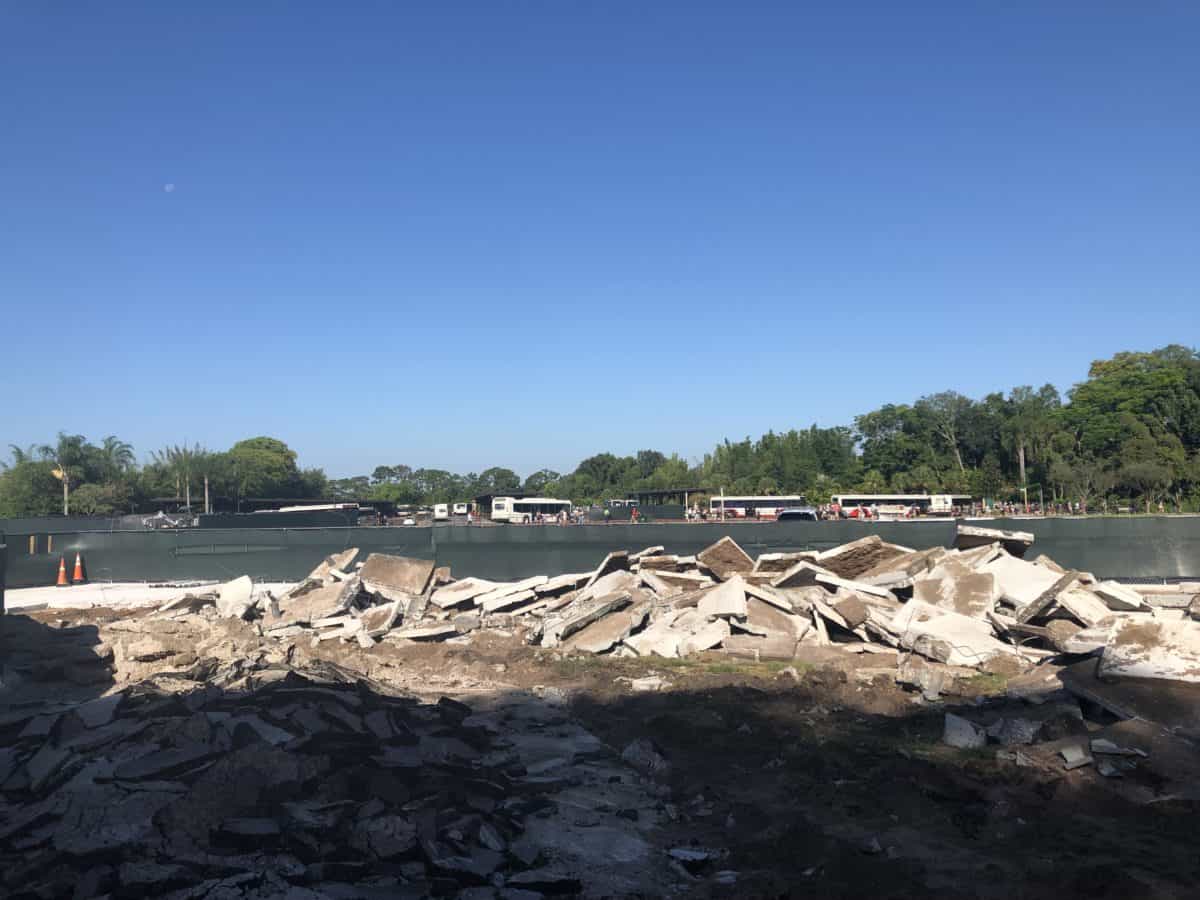 broken pavement seen over the walls in the parking lot