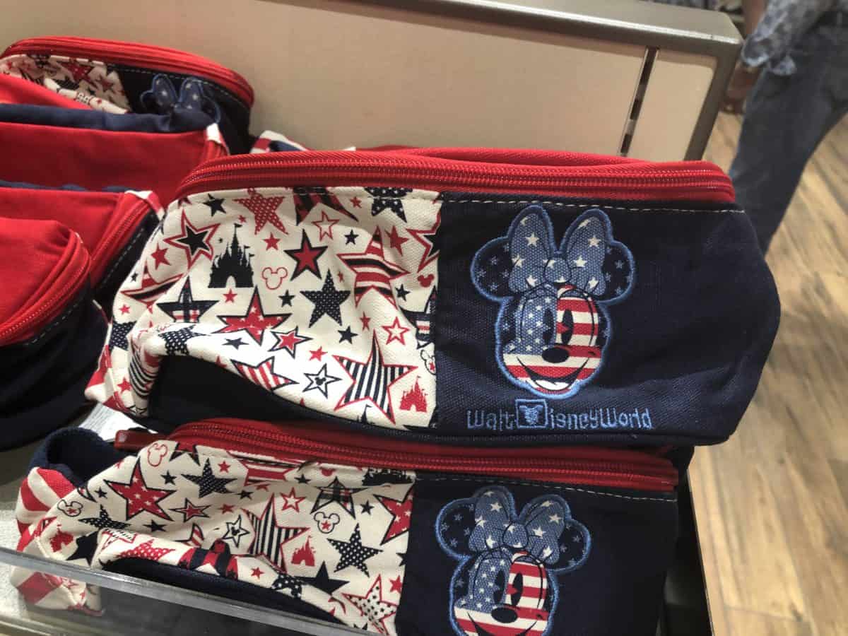 Minnie Mouse Hip Bag with stars pattern on one side and flag Minnie face on the other against a navy backgroun