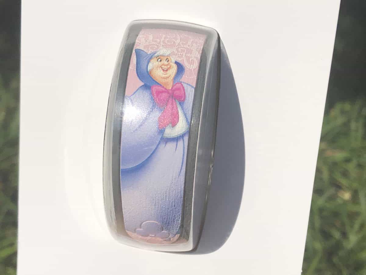 Fairy Godmother MagicBand from Bibbidi Bobbidi Boutique. Pale pink band with Cinderella's fairy godmother