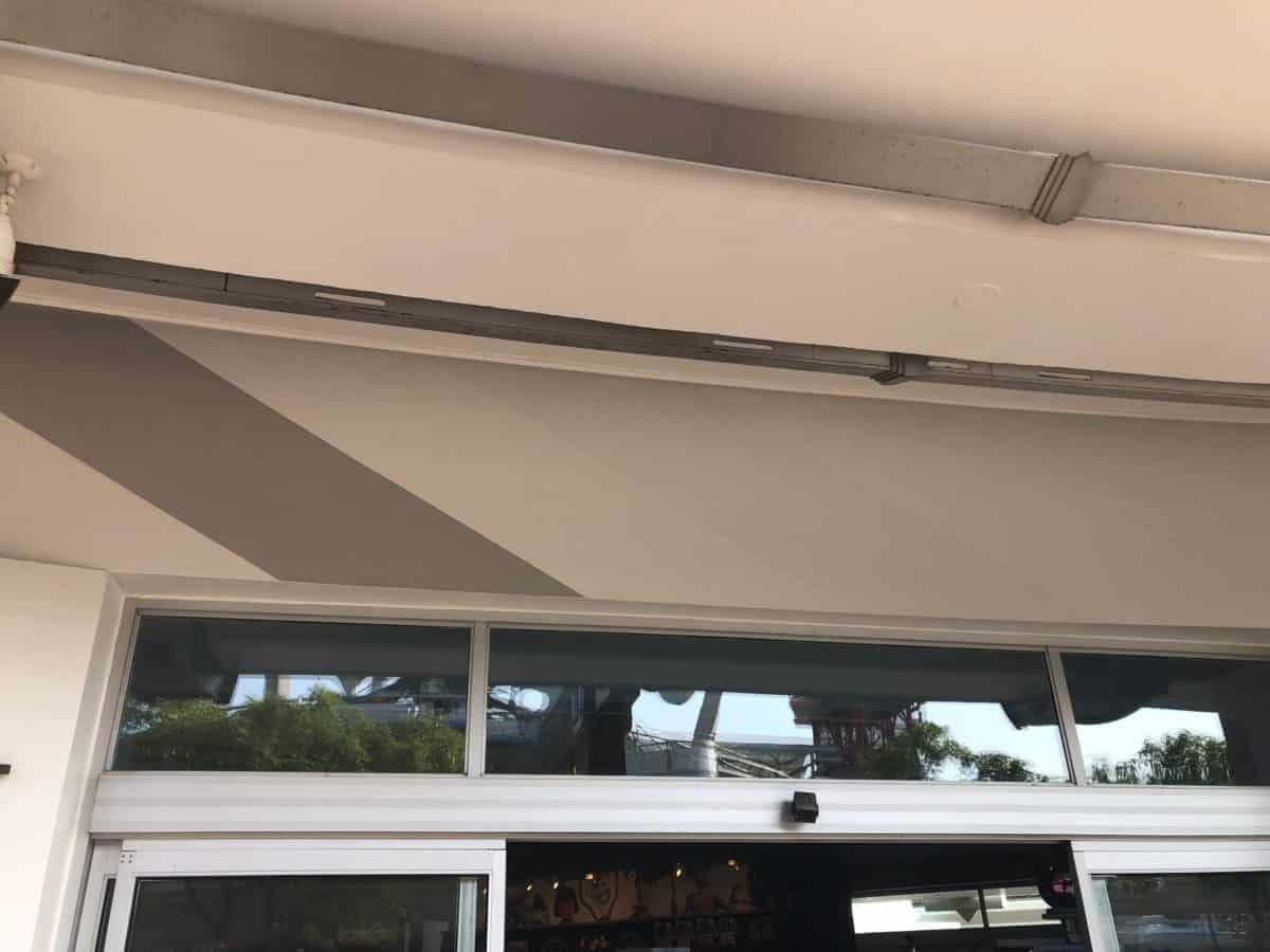a solid gray stripe and a faint silver stripe above a door