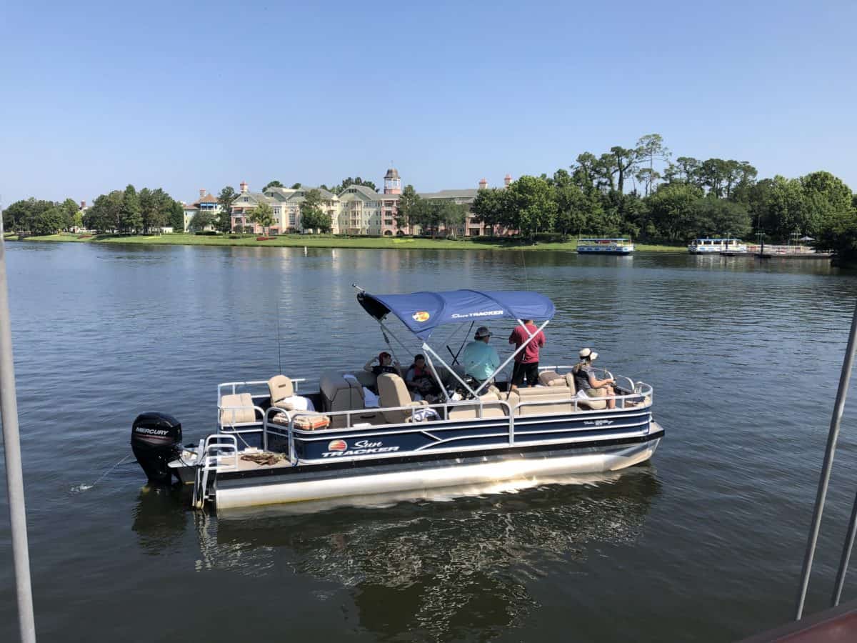 family on a boat fishing