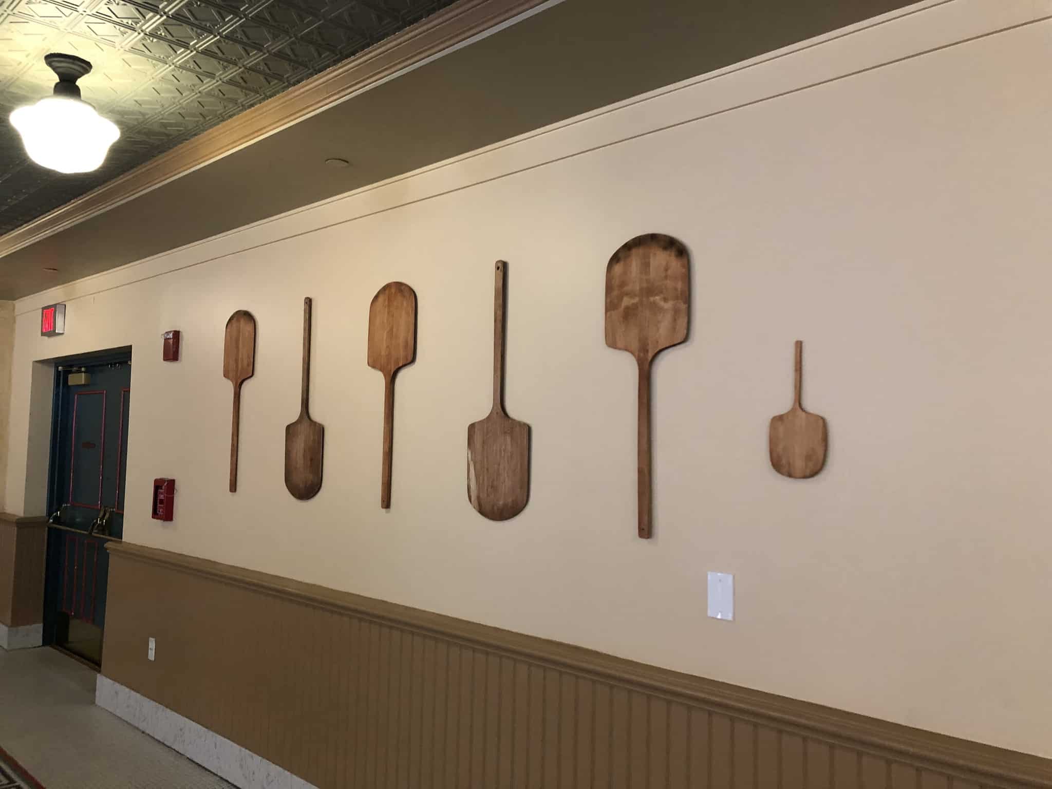 Pizza Boards on the wall of PizzeRizzo
