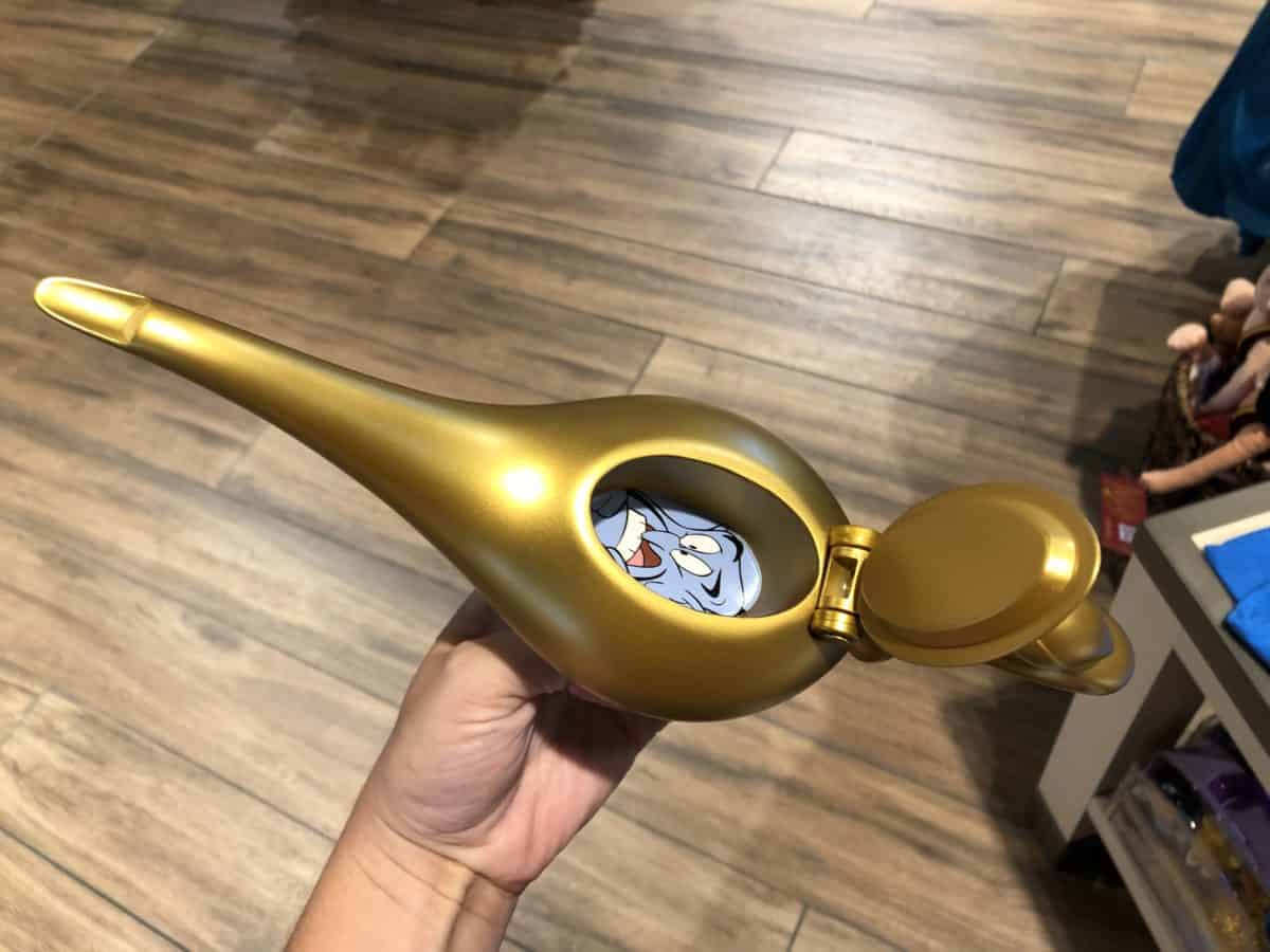 Lid open on the Magic Lamp with Genie inside.