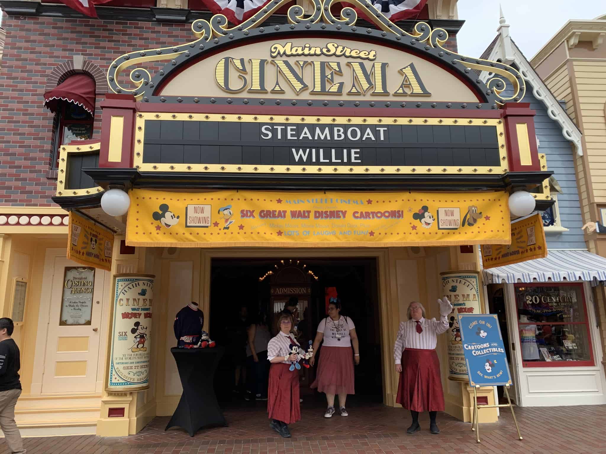 Cast members try to get guests to come into the new store, perhaps also warning purists to not enter.