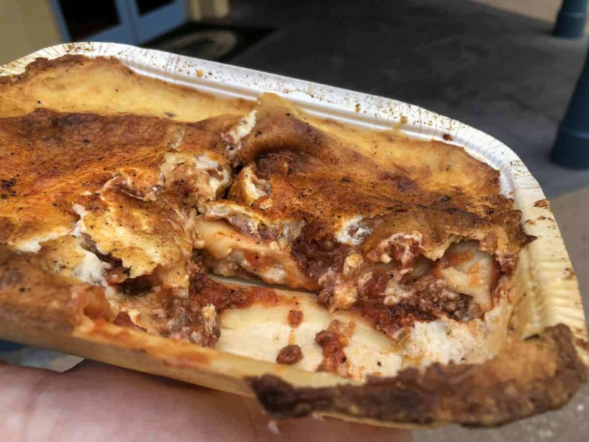 messy layers of meat and cheese lasagna cut into