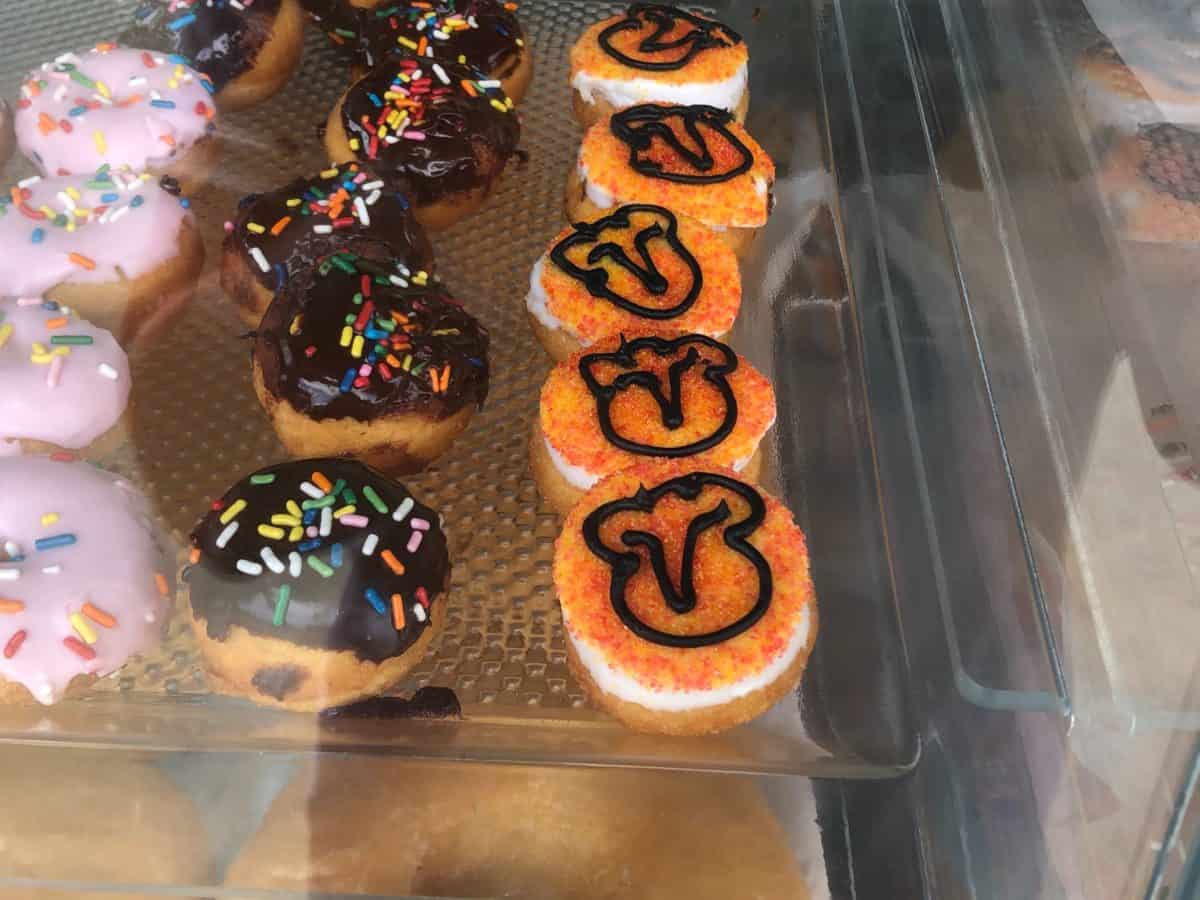 mini donuts with orange sprinkles and simba face outline