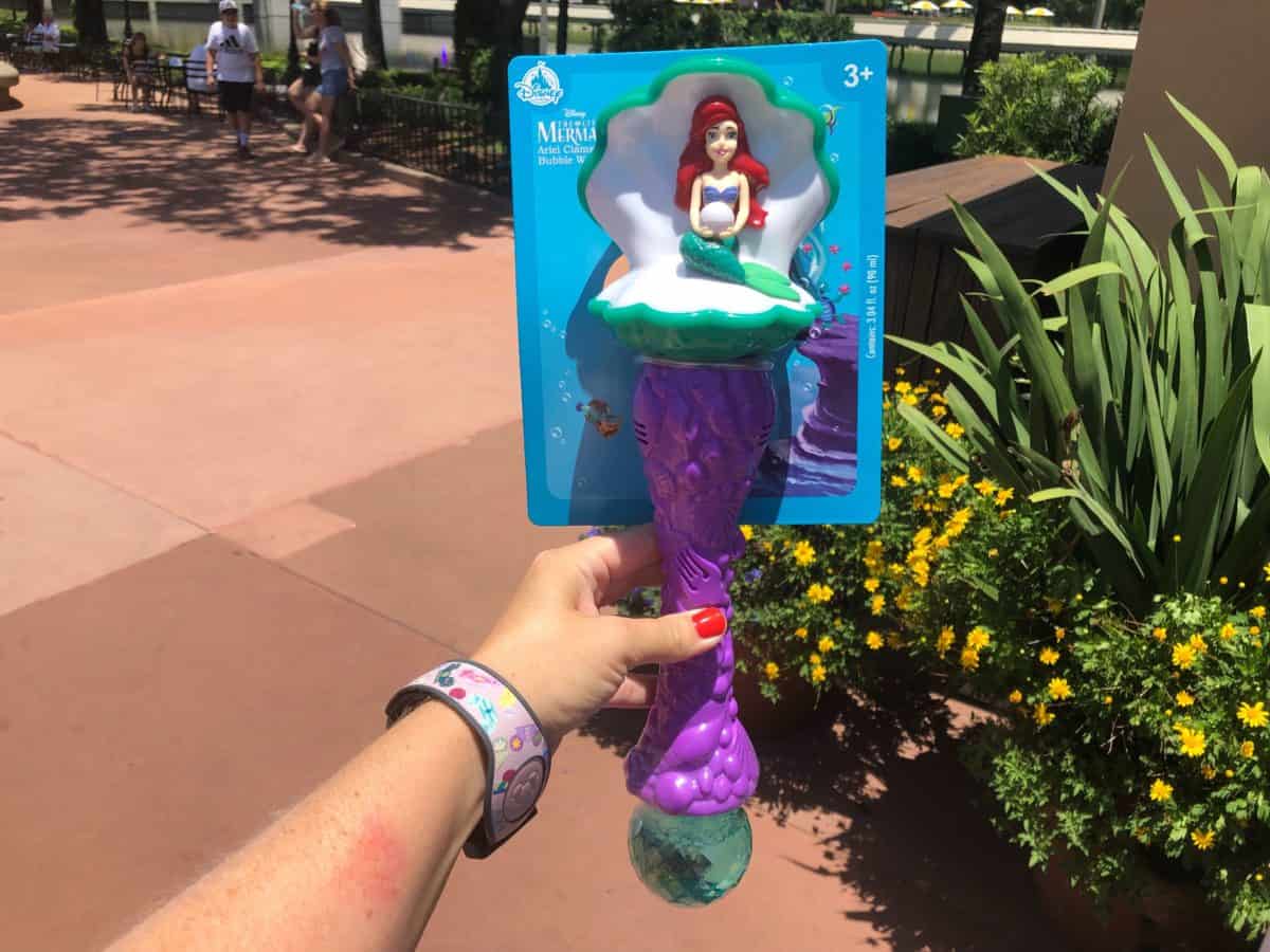 Ariel sitting in a Clamshell Bubble Wand