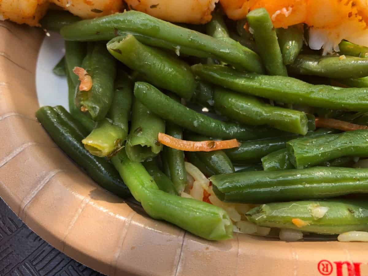 green beans with a shredded carrot