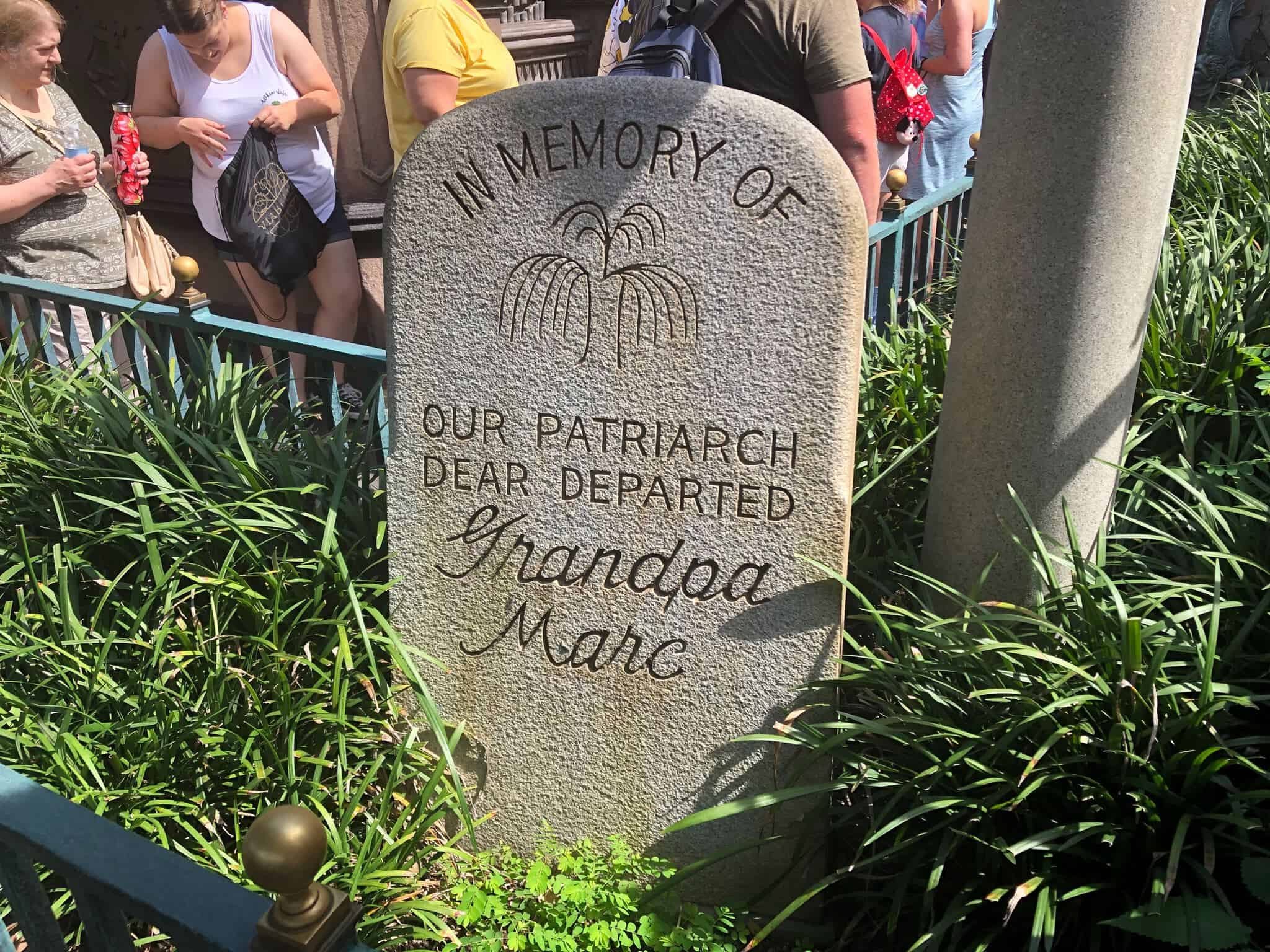 Grandpa Marc Headstone from Haunted Mansion queue