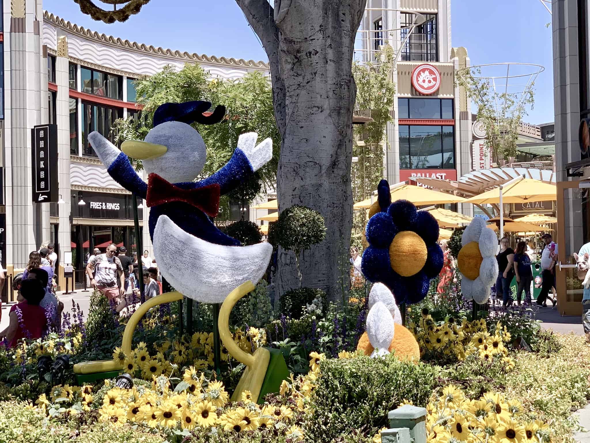 Downtown Disney District July 1 2019 Mickey and Friends Abstract Topiaries, Retro Disney Parks Collage Loungefly, and More