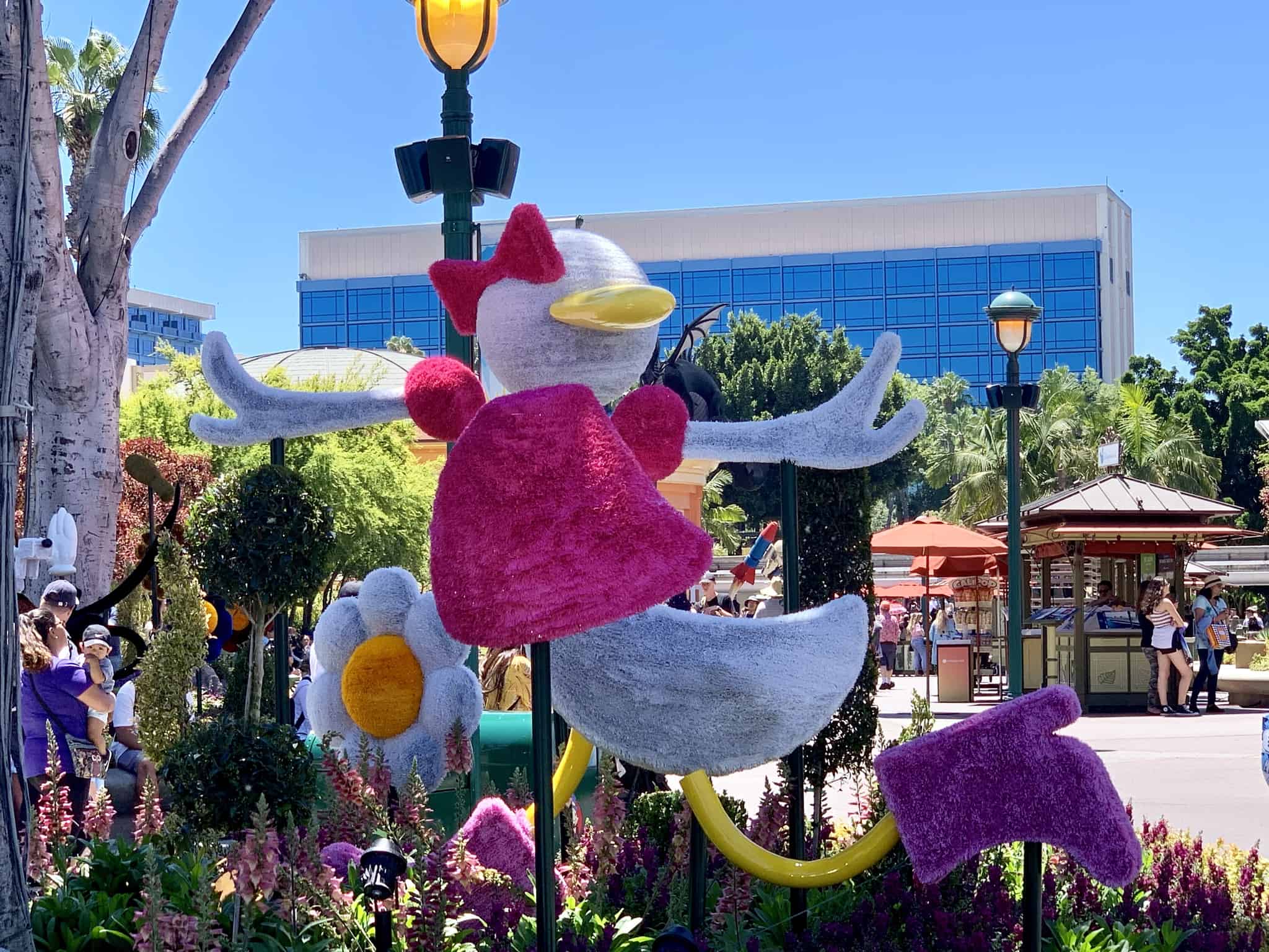 Downtown Disney District July 1 2019 Mickey and Friends Abstract Topiaries, Retro Disney Parks Collage Loungefly, and More