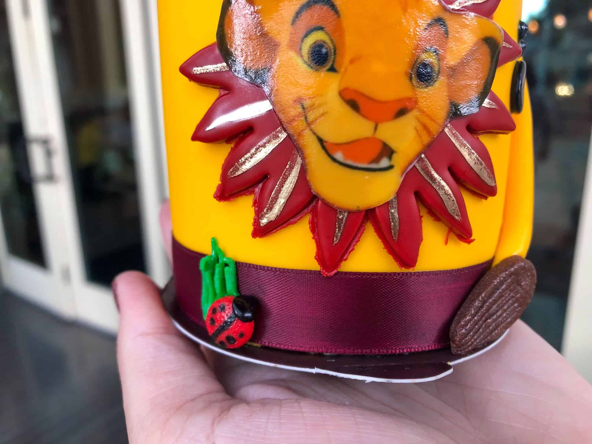 Ribbon around the bottom of the cake with fondant lady bug