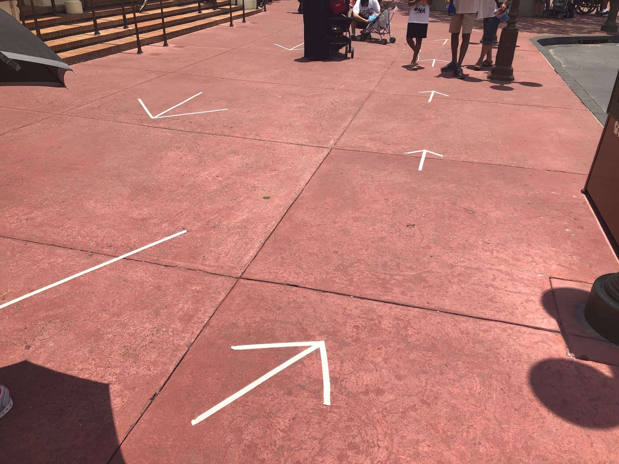 Tape arrows to help with guest flow at Magic Kingdom