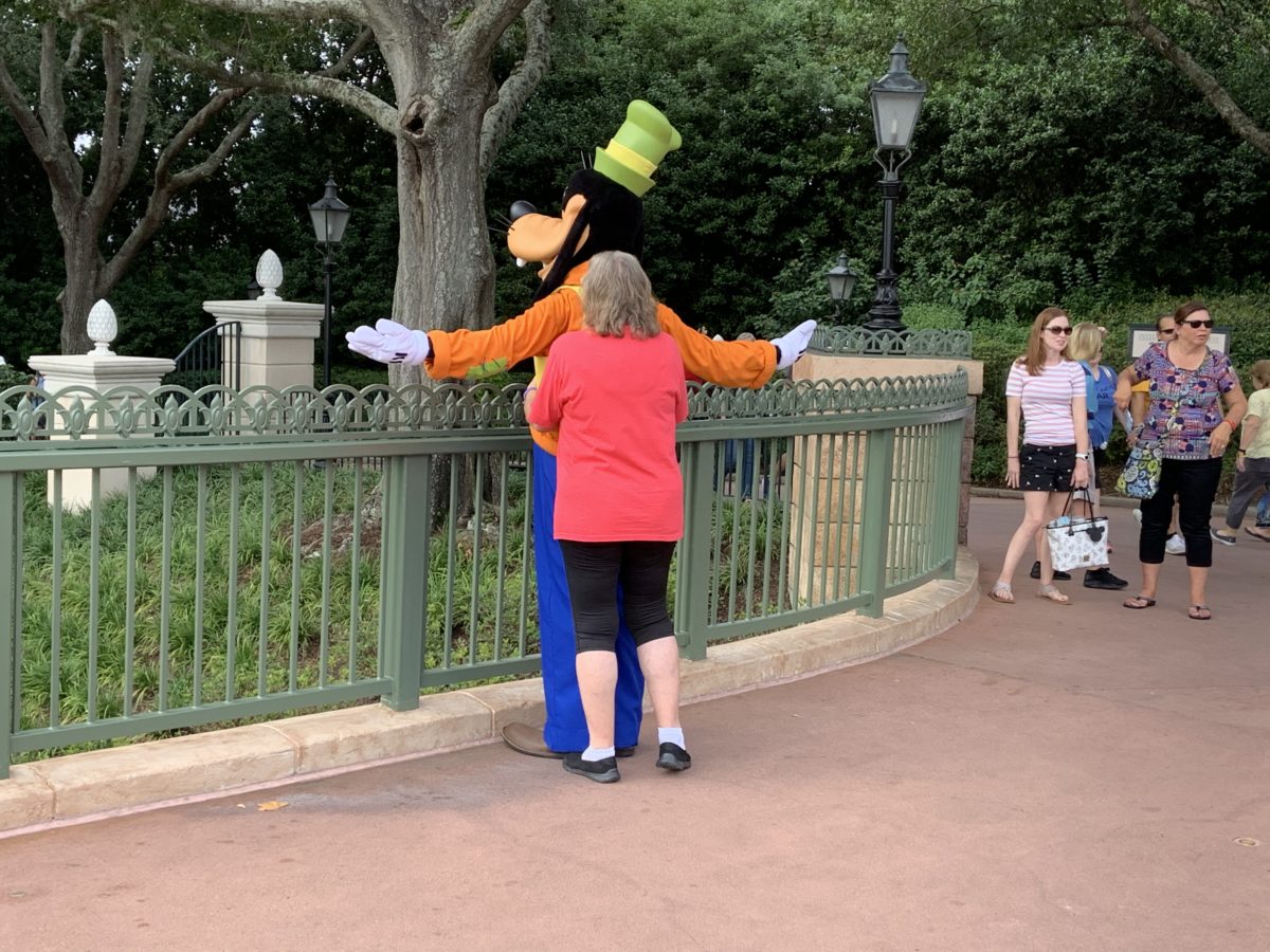 Goofy and a guest in EPCOT