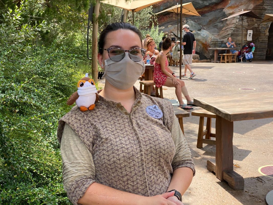 star wars galaxy's edge cast member with porg wearing mask