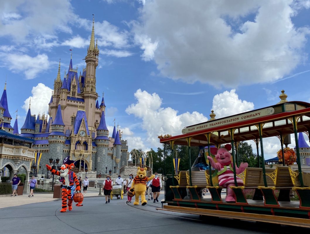 Winnie the Pooh and friends on Trolley in front of Cinderella Castle