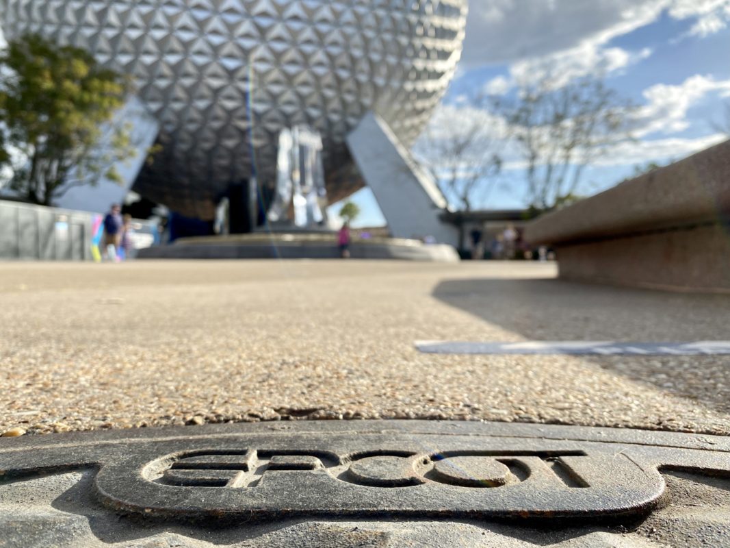 spaceship-earth-entrance-fountain-themed-manhole-cover-featured-image-hero-epcot-02112021-7486290