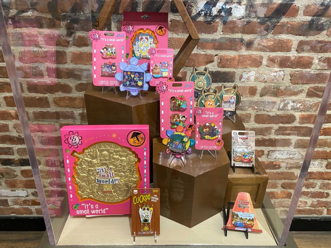 new limited edition "it's a small world" and Loki pins arrive at Downtown Disney