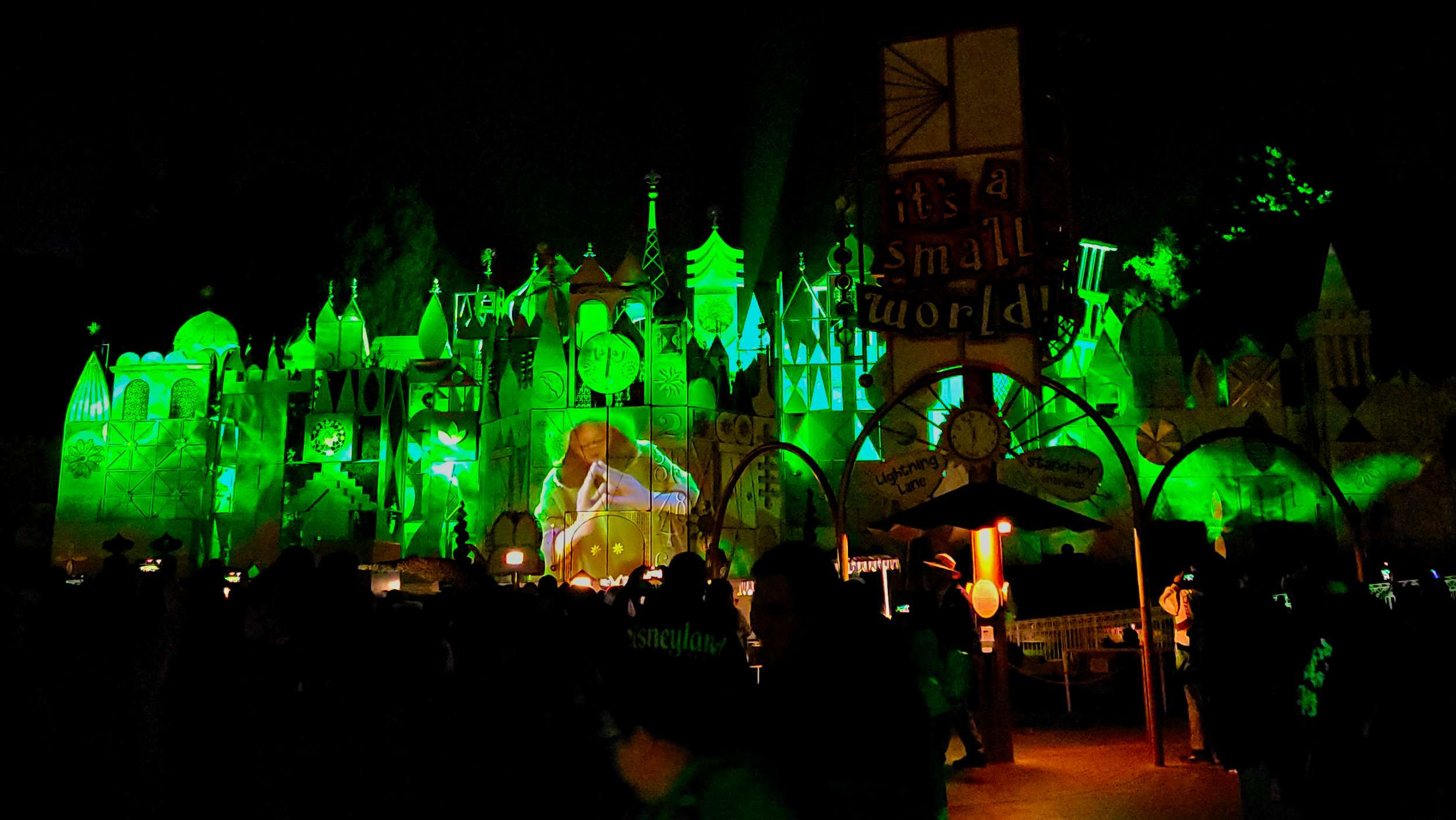 "We Don't Talk About Bruno" projection show on "it's a small world" facade