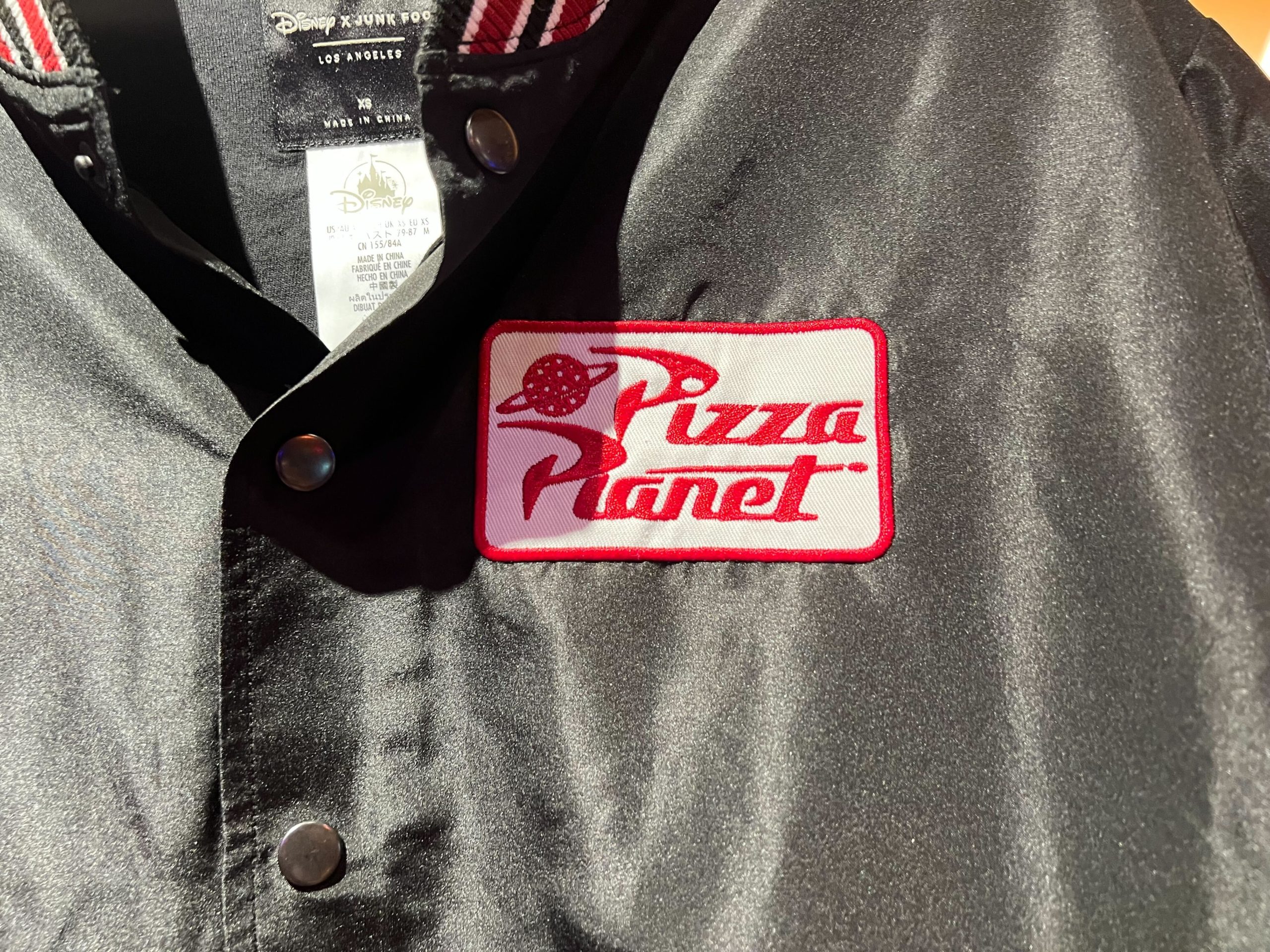 Pizza planet bomber jacket patch close up
