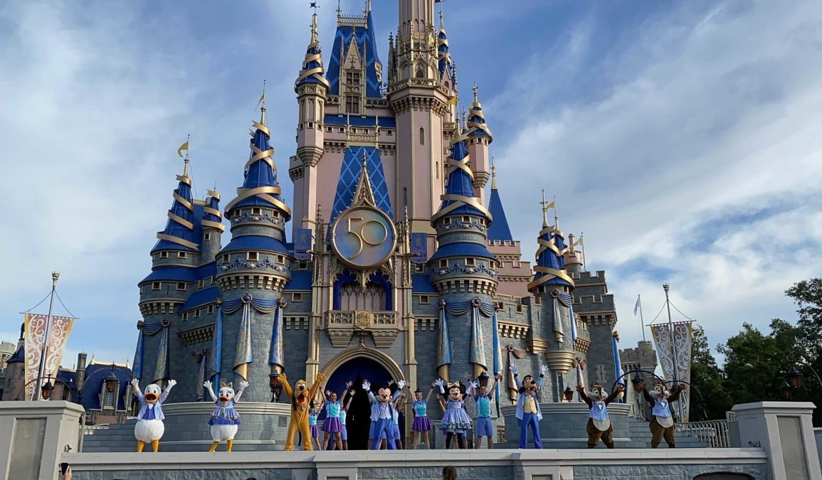 Let the Magic Begin stage show in front of Cinderella Castle with 50th anniversary decorations