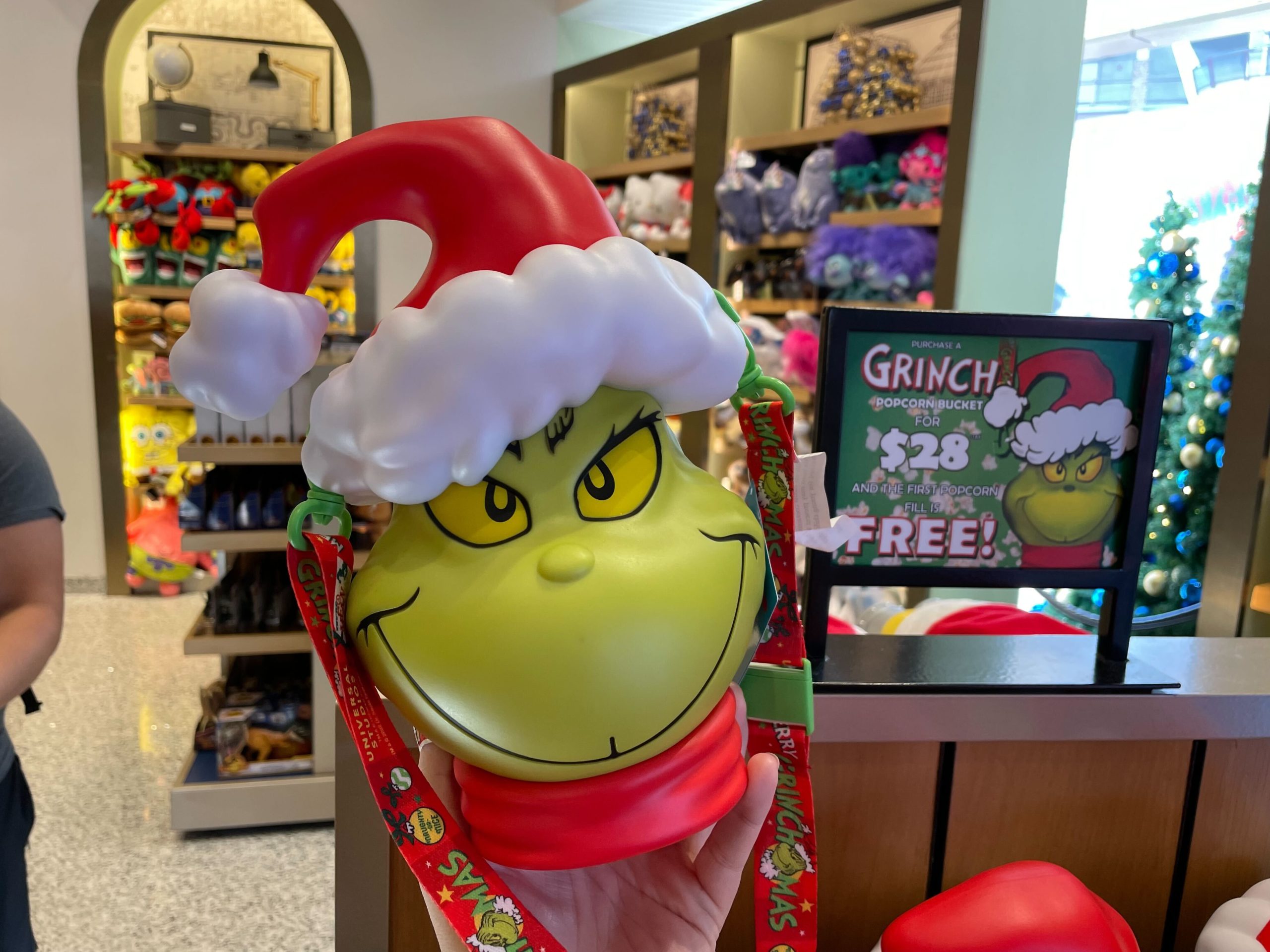 Grinch Head Popcorn Bucket wearing Santa hat