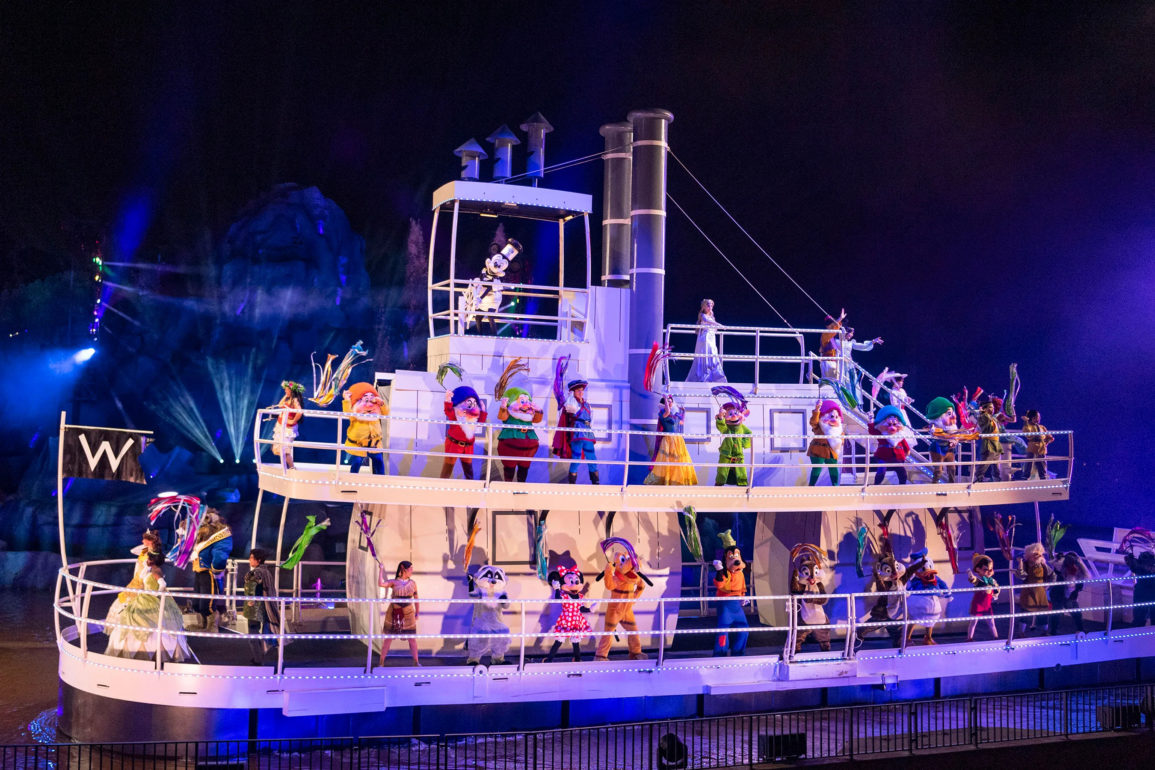 Characters on Steamboat Willie riverboat during Fantasmic