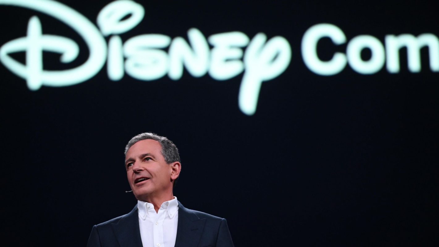 Bob Iger below Disney Company sign
