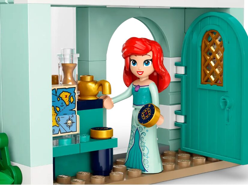 A LEGO mini doll of Ariel shows off her treasures.