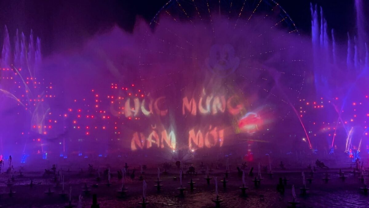 "Happy New Year" in Vietnamese is projected on the water screens.