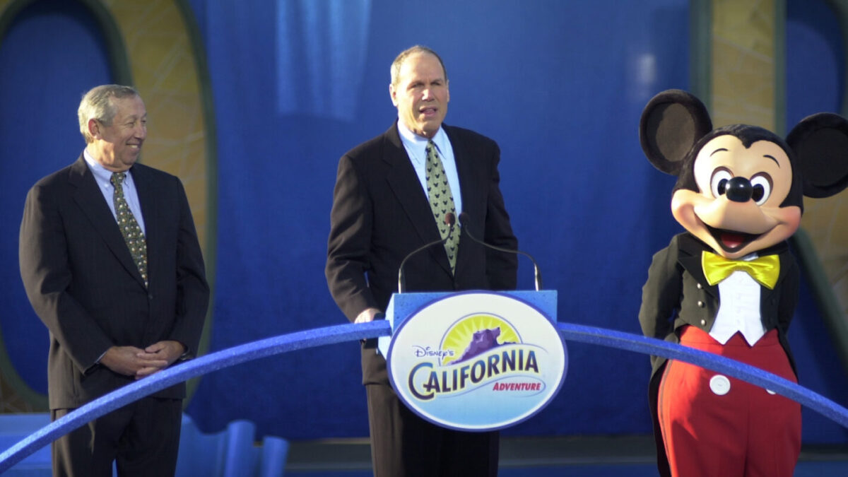 Roy E. Disney, Michael Eisner, and Mickey Mouse at the opening of Disney California Adventure.