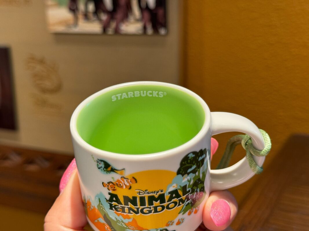 A reporter shows the inside of the mug ornament.
