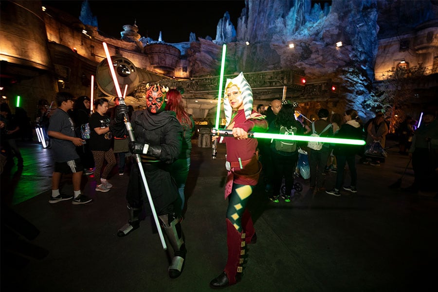 Guests cosplaying as Star Wars characters in Galaxy's Edge.