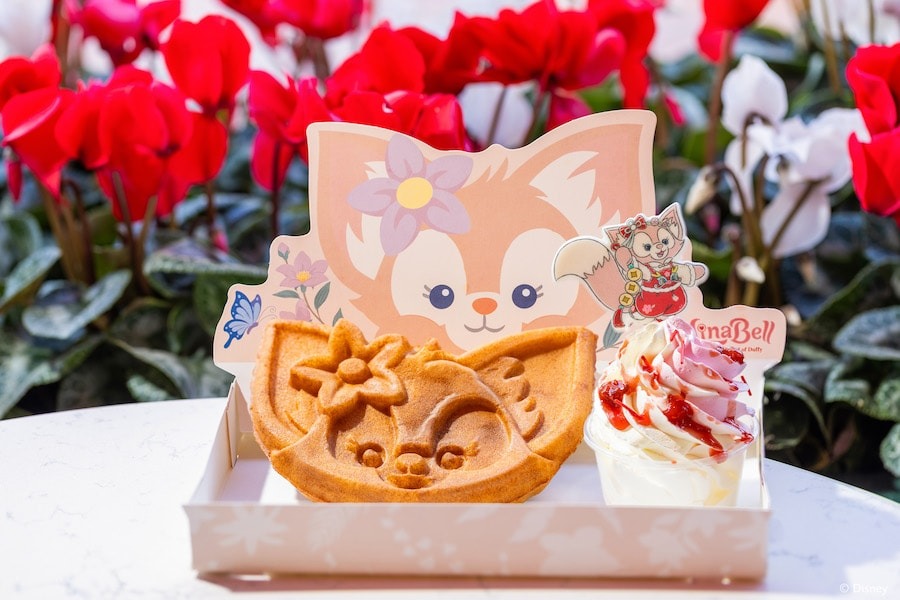 A Disney LinaBell waffle sits in a commemorative tray.