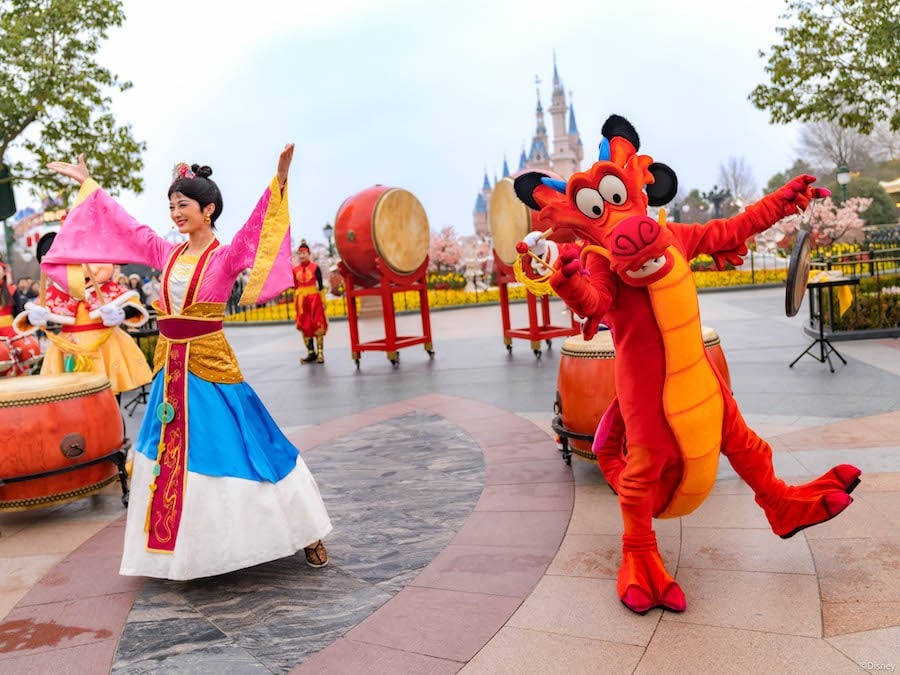 Mulan and Mushu celebrate Chinese New Year during the Spring Festival Drum Ceremony.