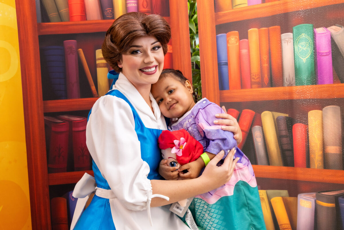 Belle with child in Ariel outfit